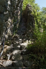 France, Ardeche, Monts d'Ardeche Regional Natural Park, Thueyts,  staircase carved into the rock between the Ardeche River and the village