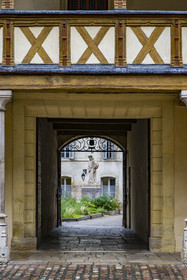 France, Cote d'Or, Beaune, area listed as World Heritage by UNESCO, Hospices de Beaune, Hotel Dieu, Founders' Courtyard, statue of Nicolas Rolin who created the hospices with his wife Guigone de Salins