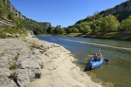 France, Ardeche, Balazuc, kayaks going down the Ardeche River between Balazuc and Pradons