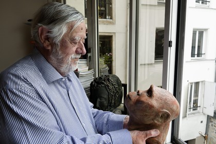 France, Paris, the french paleontologist and paleoanthropologist Yves Coppens, professor at the College de France, in the office of his home in Paris, he holds in his hand the supposed reproduction of Lucy's face