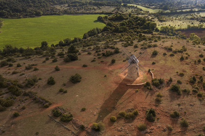 France, Aveyron, Causses and the Cévennes, cultural landscape of Mediterranean agro-pastoralism, listed as World Heritage by UNESCO, La Couvertoirade, labelled Les Plus Beaux Villages de France (The Most Beautiful Villages of France), fortified village on the Larzac plateau, the Redounel mill (aerial view)