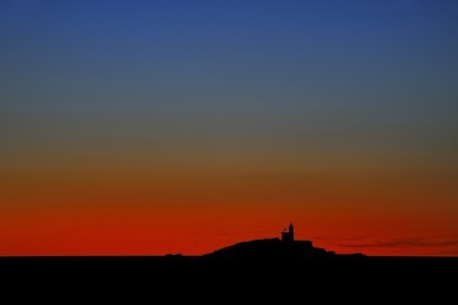 Italy, Tuscany, lighthouse off the coast of Portoferraio on the Island of Elba at sunset