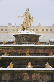 France, Yvelines, snow covered park of the Chateau de Versailles, listed as World Heritage by UNESCO, the Latona Basin