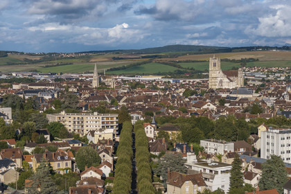France, Yonne, Auxerre, Saint-Germain Abbey on the left and Saint Etienne Cathedral on the right, the hills surrounding the city in the background (aerial view)