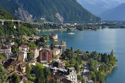 Switzerland, Canton of Vaud, Montreux in the foreground and the Chillon castle on the shores of Lake Geneva (Lac Leman) at Veytaux