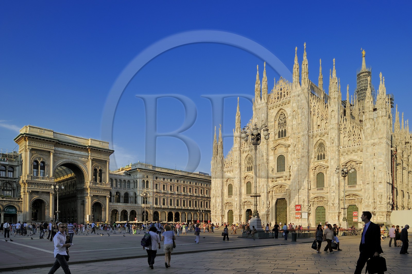 Italy, Lombardy, Milan, Piazza del Duomo, entry of Vittorio Emmanuel II Gallery, shopping arcade built on the 19th century by Giuseppe Mengoni and the Duomo Gothic style cathedral in the historical center