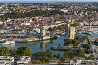 France, Charente Maritime, La Rochelle, the Old Port, Tour de la Chaine left and Tour Saint Nicolas right protect the entrance to the Old Port (aerial view)
