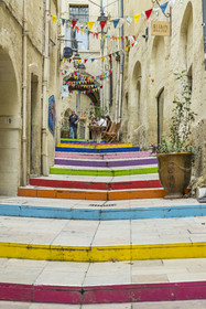 France, Herault, Montpellier, historic center called the Ecusson, rue du Bras de Fer with its risers painted in street art