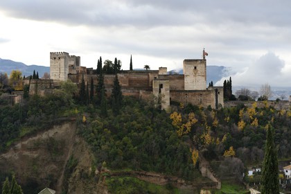 Spain, Andalusia, Granada, the Alhambra Alcazaba, listed as World Heritage by UNESCO, and the Sierra Nevada mountains
