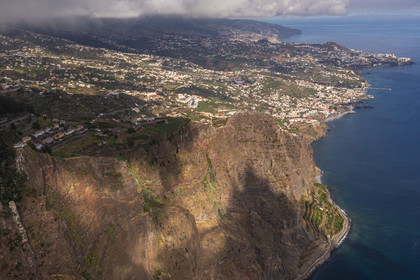 Portugal, Madeira Island, Camara de Lobos, the Cap Girao belvedere, a glass platform overlooking the second highest cliff in the world at 589 meters high, cultivated fields at the foot of the cliff (aerial view)