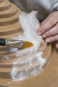 France, Gard, Bagard, Atelier Sericyne, production of exceptional and non-woven silk for the creation of decorative and lifestyle objects in silk, placement of a piece of silk threads on a mold with brush and water application