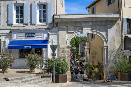 France, Bouches du Rhone, Regional Natural Park of the Alpilles, Saint Remy de Provence, Rue de la Commune behind the Porte Saint-Paul which marks the entrance to the old town