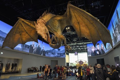 United Kingdom, Hertfordshire, Leavesden, Leavesden Film Studios, Harry Potter Studio Tour London, the scene of the eight Harry Potter movies' making of, giant flying dragon overlooking the visitors at the entrance of the exhibition