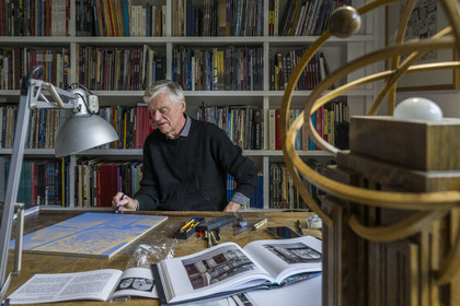 France, Paris, cartoonist and comic book author François Schuiten in his Parisian studio, He is making adjustments to his drawing on one of the future ceramic plaques that will adorn the platform of the Pont de Sèvres metro station on the future Grand Paris Express network.