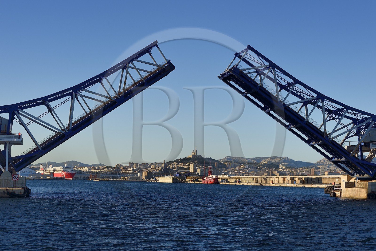 France, Bouches du Rhone, Marseille, Euroméditerranée Zone, Great Seaport of Marseille, the Pinede bridge (bascule mobile bridge) and Notre-Dame de la Garde in the background
