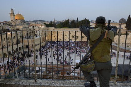 Israel, Jerusalem, holy city, the old town listed as World Heritage by UNESCO, the Western Wall part of the retaining walls of the Temple Mount built by Herod the Great under the surveillance of an armed soldier