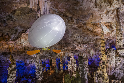 France, Gard, Mejannes-le-Clap, grotte de La Salamandre (Salamander cave), discovery of the cave in Aéroplume®, an individual dirigible balloon inflated with helium which allows you to fly away by flapping your wings