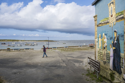 France, Finistère, Iroise Sea, Molene Island, the port, the shelter of the former rowing lifeboat Amiral Roussin from 1894 to 1950 covered with frescoes painted by Laurent Mordelet which retrace the life and history of the island