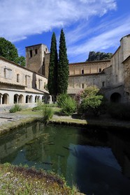 France, Herault, Medieval town of Saint-Guilhem-le-Desert, a stop on el Camino de Santiago, pilgrimage route to Compostela, labelled Les Plus Beaux Villages de France (The Most Beautiful Villages of France), abbey of Gellone from the 11th century listed as World Heritage by UNESCO, the cloister