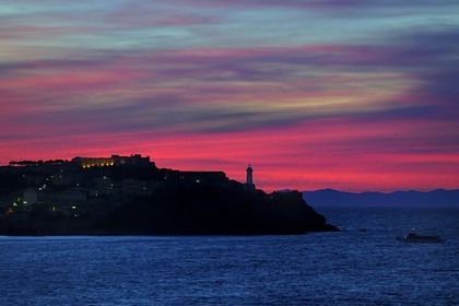 Italy, Tuscany, Elba Island, lighthouse of Portoferraio at sunset