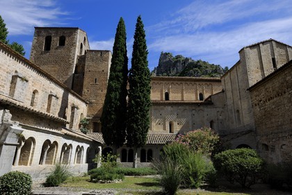 France, Herault, Medieval town of Saint-Guilhem-le-Desert, a stop on el Camino de Santiago, pilgrimage route to Compostela, labelled Les Plus Beaux Villages de France (The Most Beautiful Villages of France), abbey of Gellone from the 11th century listed as World Heritage by UNESCO, the cloister
