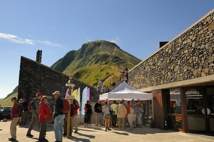 France, Cantal, Monts du Cantal, Parc Naturel Regional des Volcans d' Auvergne (Regional Nature Park of the Volcanoes of Auvergne), the Puy Mary (1783m) at the Col de Pas de Peyrol (1589m) in the foreground, excursions departure