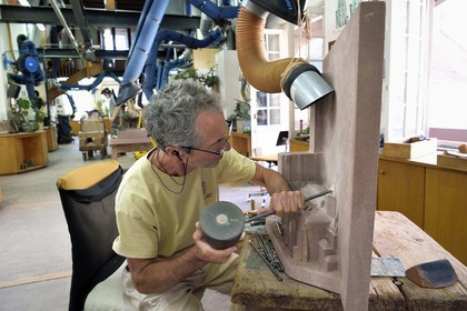 France, Bas Rhin, Strasbourg, old town listed as World Heritage by UNESCO, sculpture and stonemasons' workshops of the Oeuvre Notre-Dame Foundation, Pierre Beaugey, tailleur de pierre et responsable de l'atelier de taille, travaille sur une réduction de la cathédrale pour être un plan pour les non-voyants