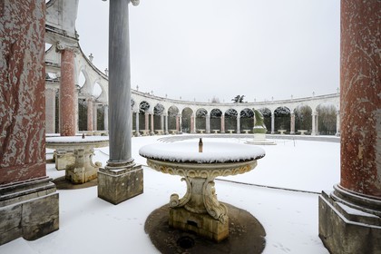 France, Yvelines, snow covered park of the Chateau de Versailles, listed as World Heritage by UNESCO, Bosquet de la Colonade, round peristyle by Mansart