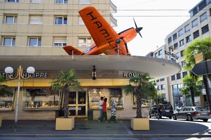 Switzerland, Canton of Vaud, Montreux, watchmaker and jeweler on avenue du Casino, advertising aerobatic aircraft for Hamilton watches