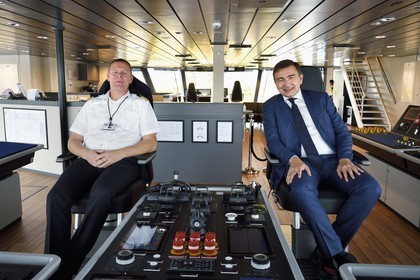 Norway, Ostfold County, Halden, Nexans Aurora cable-laying vessel, Norwegian captain Bjarte Sylta and Nexans CEO Christopher Guérin on the bridge