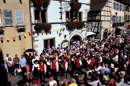 France, Haut Rhin, Eguisheim village, labelled Les Plus Beaux Villages de France (The Most Beautiful Villages of France), wine celebration, parade in traditional costume in the main road