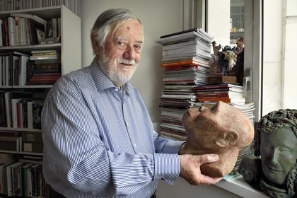France, Paris, the french paleontologist and paleoanthropologist Yves Coppens, professor at the College de France, in the office of his home in Paris, he holds in his hand the supposed reproduction of Lucy's face