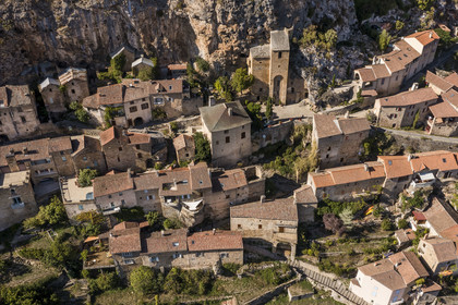 France, Aveyron, Grands Causses Regional Nature Park, Peyre, labelled Les Plus Beaux Villages de France (The Most Beautiful Villages of France), houses and Saint-Christophe troglodyte church from the 11th and 17th centuries