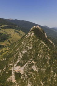 France, Ariege, Pays d' Olmes, Cathar Castle of Montsegur perched on a rock and the Pyrenees (aerial view)..