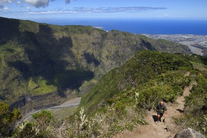France, Reunion island (French overseas department), Reunion National Park listed as World heritage by UNESCO, La Possession, around village of Dos d'Ane, Roche Bouteille hike by the Cap Noir trail, the Rivière des Galets below and on the west coast in the background