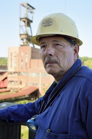 France, Moselle, Petite Rosselle, carreau Wendel museum, the former miner Gaston Mai in front of the mine shaft headframe Wendel 2