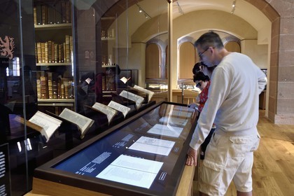 France, Bas Rhin, Selestat, the Humanist Library refitted by architect Rudy Ricciotti, digital reading of the books on the back of the screens, the personal library of Beatus Rhenanus (1485-1547) is in the background in the glass room