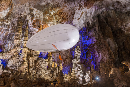 France, Gard, Mejannes-le-Clap, grotte de La Salamandre (Salamander cave), discovery of the cave in Aéroplume®, an individual dirigible balloon inflated with helium which allows you to fly away by flapping your wings