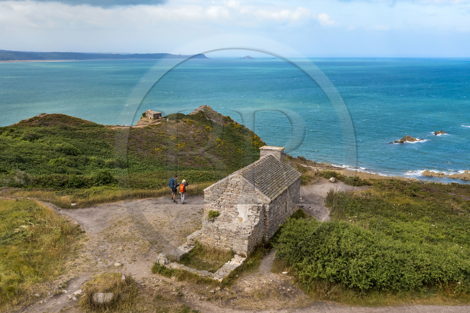 France, Cotes d'Armor, Grand Site de France Cap d'Erquy - Cap Frehel, Erquy, hikers on the GR34 hiking trail or coastal trail at Pointe des Trois Pierres on Cap d'Erquy (aerial view)