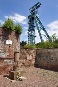 France, Moselle, Petite Rosselle, mine shaft Saint Charles, monument in tribute to the dead miners during accidents at Saint Charles and Saint Joseph mine shafts and the Saint Charles mine headframe in the background