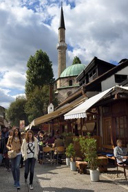 Bosnia and Herzegovina, Sarajevo, Bascarsija district in the old town, Bravadziluk street famous for its Burek and cevapi restaurants, Bascarsijska mosque (Bascarsijska dzamija) in the background