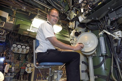 France, Var, Toulon, the naval base (Arsenal), Commander Nicolas Faure at periscope in the central navigation and operation room, Commander of the nuclear attack submarine (SNA) Casabianca (Rubis type)