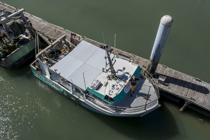 France, Charente Maritime, Oleron island, port of La Cotinière, flood basin built in 2022 at the foot of the new fish market, fisherman Yoann Crochet on his trawler L'Univers intended for artisanal coastal fishing (aerial view)