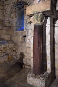 France, Dordogne, Brantome, Saint Pierre benedictine abbey, the bell tower foundations of the abbey church (11th century), certainly the oldest bell tower in France, red marble column from a Gallo-Roman temple built in this place before the abbey construction