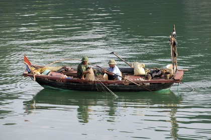 Vietnam, Quang Ninh Province, Halong Bay, listed as World Heritage by UNESCO, fishing boat