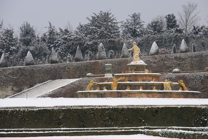 France, Yvelines, snow covered park of the Chateau de Versailles, listed as World Heritage by UNESCO, the Latona Basin