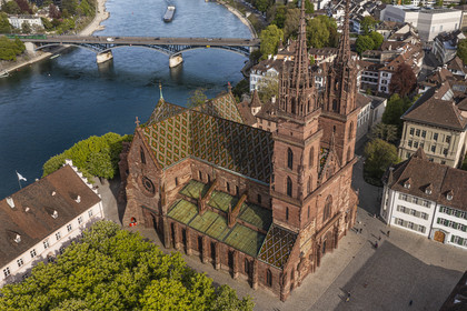 Switzerland, Basel, the left bank of the Rhine, the Minster or Protestant Cathedral of Our Lady of Basel (Munster) overlooking the Rhine, the Wettsteinbrucke bridge in the background (aerial view)