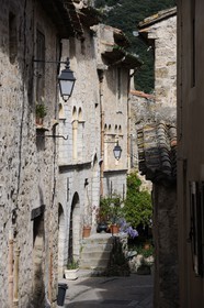 France, Herault, Saint Guilhem le Desert Medieval Village, Labelled Les Plus Beaux Villages de France (the Most Beautiful Villages of France), Rue de la Chapelle des Penitents with the house Lorimi in the back left