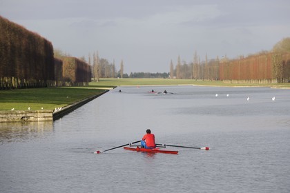 France, Yvelines, parc du Chateau de Versailles, listed as World Heritage by UNESCO, small boats on the Grand Canal in Autumn