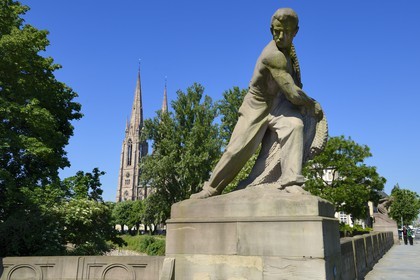 France, Bas Rhin, Strasbourg, Neustadt district dating from the german period, the Kennedy bridge also called four giants bridge, fisherman with his net